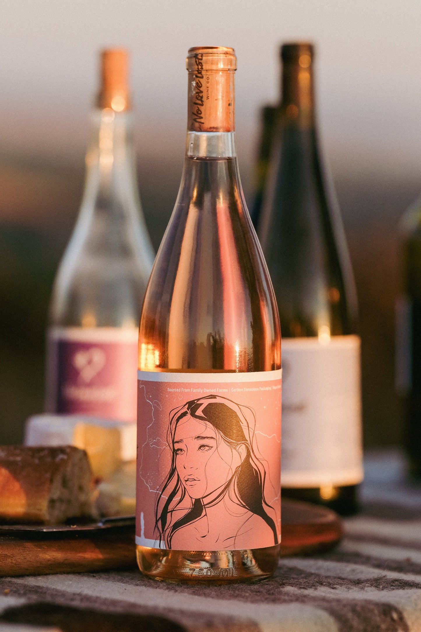 2023 No Love Lost Rosé — organic family-owned vineyard on east Lodi, sustainably farmed and CCOF certified. Grenache clones Entav & Davis, lightly foot-treaded, tank fermented, aged 6 months in neutral Loire oak. Aromas of watermelon rind, strawberry, and stone fruit; ripe peach palate with bright, long-lasting acidity. 12.1% ABV.