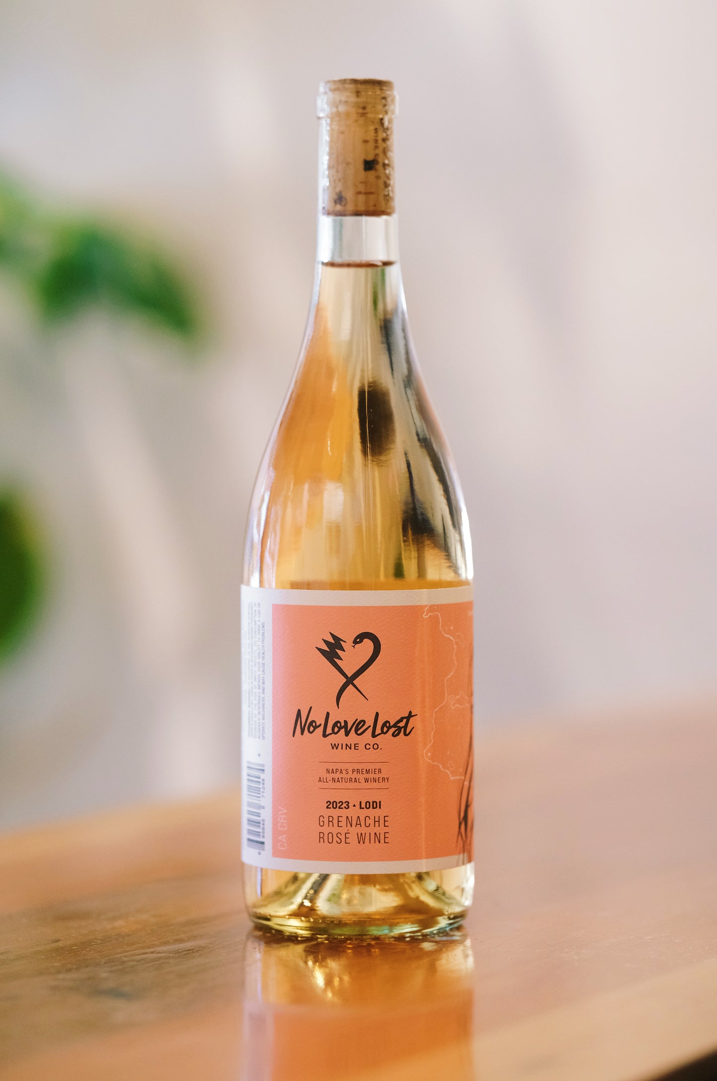 2023 No Love Lost Rosé — organic family-owned vineyard on east Lodi, sustainably farmed and CCOF certified. Grenache clones Entav & Davis, lightly foot-treaded, tank fermented, aged 6 months in neutral Loire oak. Aromas of watermelon rind, strawberry, and stone fruit; ripe peach palate with bright, long-lasting acidity. 12.1% ABV.