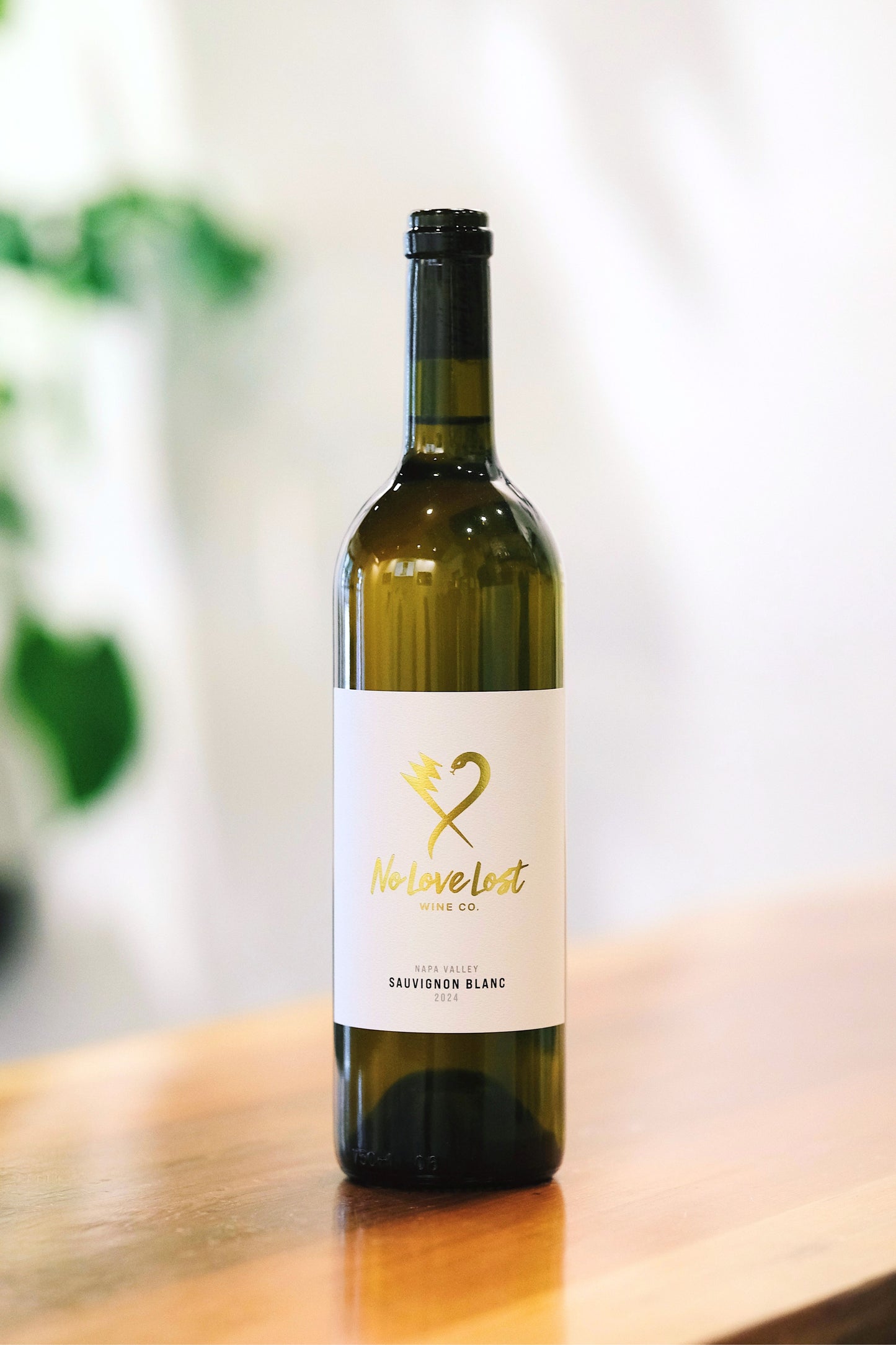 2024 No Love Lost Napa Valley Sauvignon Blanc — Saint Helena AVA single-vineyard wine grown on deep alluvial clay soils. Whole cluster pressed, stainless steel fermented, aged 6 months in neutral Loire oak. Tropical guava and passionfruit with yellow peach, Valencia orange, and zesty acidity. 12.6% ABV.