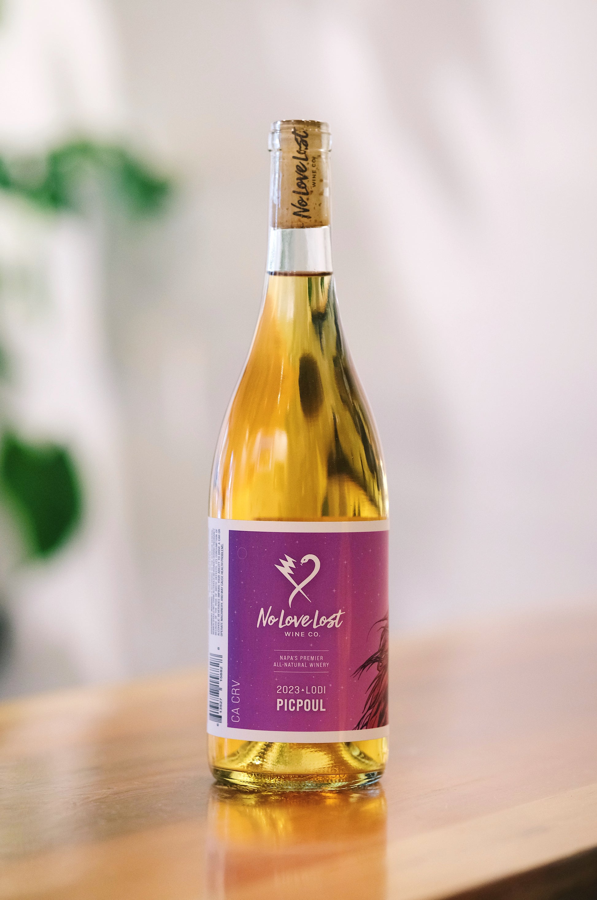 2023 No Love Lost Orange Picpoul — organic, family-owned vineyard in Lodi AVA. Skin-contact white wine with dried herbs, matchstick, golden oats, honey, citrus, and orange blossom notes. High acidity, fermented with 100% stem and skin inclusion, aged 11 months in neutral Burgundy barrels. 10.8% ABV.