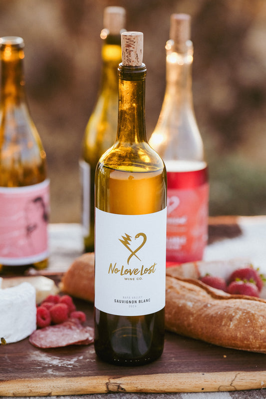 2024 No Love Lost Napa Valley Sauvignon Blanc — Saint Helena AVA single-vineyard wine grown on deep alluvial clay soils. Whole cluster pressed, stainless steel fermented, aged 6 months in neutral Loire oak. Tropical guava and passionfruit with yellow peach, Valencia orange, and zesty acidity. 12.6% ABV.